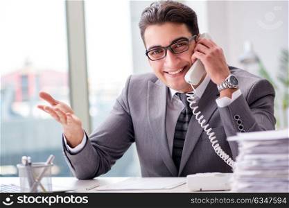 Helpdesk operator talking on phone in office