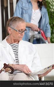 Helping senior woman on household chores