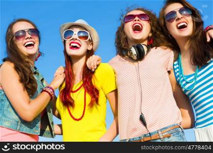 Hen party. Image of four young attractive girls having fun outdoors