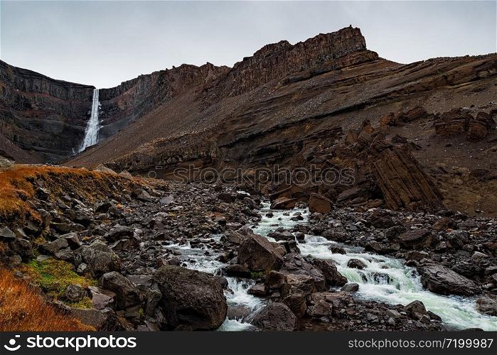 Hengifoss waterfall in eastside of Iceland in a cloudy day. Hengifoss waterfall, Iceland