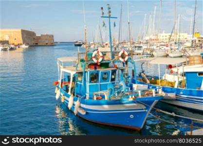 Heraklion. Fishing boats in the old port.. Fishing multi-colored boats in the old harbor of Heraklion. Crete. Greece.