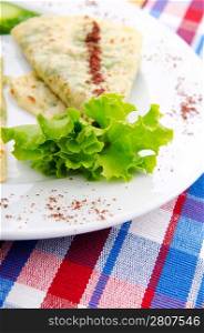Herb stuffed pancaces in the plate
