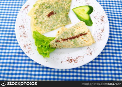 Herb stuffed pancaces in the plate