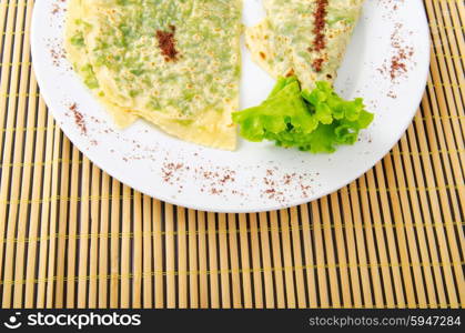 Herb stuffed pancaces in the plate