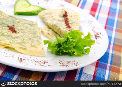 Herb stuffed pancaces in the plate