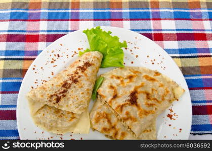 Herb stuffed pancaces in the plate