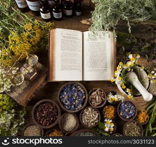 Herbal medicine on wooden desk background. Fresh medicinal, healing herbs on wooden
