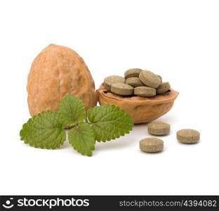Herbal pills isolated on white background. Alternative medicine concept.