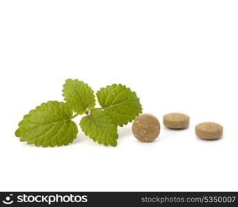 Herbal pills isolated on white background. Alternative medicine concept.