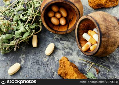 Herbal pills with healthy healing plant.Capsule pill with herb. Medicine herbal pills