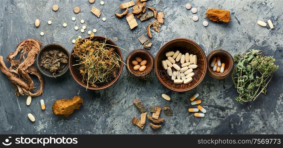 Herbal pills with healthy medical plant.Alternative medicine herbal and pills. Vitamins, tablets and pills