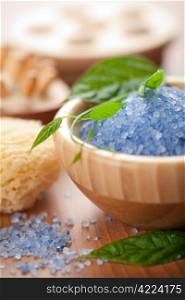 herbal salt and leaves. spa and body care background