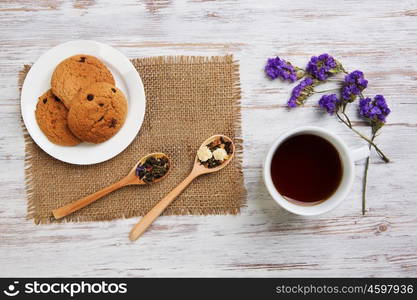 Herbal tea and cookies. Various kinds of herbal tea on wooden table