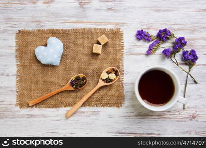 Herbal tea and cookies. Various kinds of herbal tea on wooden table