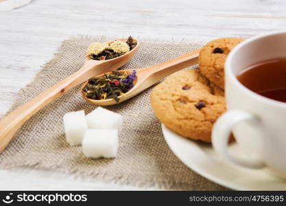 Herbal tea and cookies. Various kinds of herbal tea on wooden table