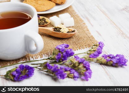 Herbal tea and cookies. Various kinds of herbal tea on wooden table