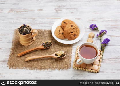 Herbal tea and cookies. Various kinds of herbal tea on wooden table