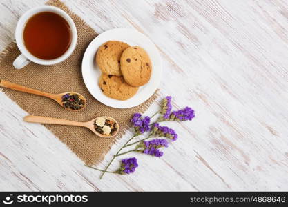 Herbal tea and cookies. Various kinds of herbal tea on wooden table