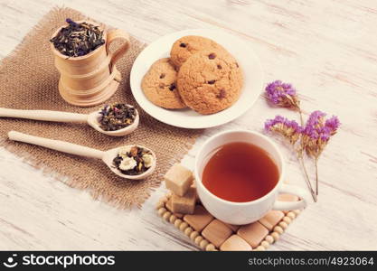 Herbal tea and cookies. Various kinds of herbal tea on wooden table