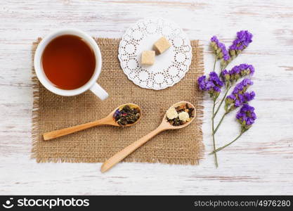 Herbal tea and cookies. Various kinds of herbal tea on wooden table