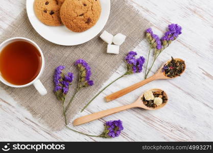 Herbal tea and cookies. Various kinds of herbal tea on wooden table