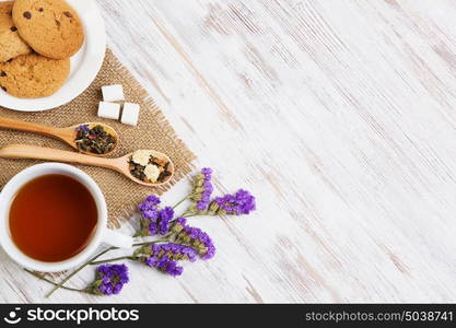 Herbal tea and cookies. Various kinds of herbal tea on wooden table