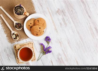 Herbal tea and cookies. Various kinds of herbal tea on wooden table