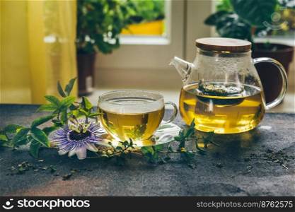 Herbal tea from the leaves of the passion flower on rustic background. Soothing natural remedy. Herbal tea from the leaves of the passion flower