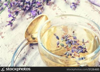 Herbal tea with lavender. natural herbal tea with flowering lavender sprigs.Photo toned