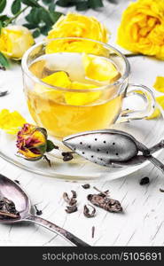 Herbal tea with yellow rose. Fragrant herbal tea with petals yellow tea rose