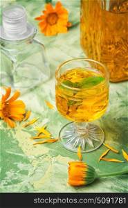 Herbal tincture with calendula. Medicinal herbal tincture for alcohol with calendula