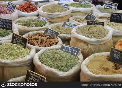 Herbes and spices in jute bags on a Provencal market in France