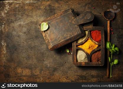 Herbs and spices. Fresh delicious ingredients for healthy cooking on rustic background, top view. Diet, cooking, clean eating or vegetarian food concept.