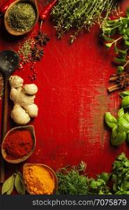 Herbs and spices. Fresh delicious ingredients for healthy cooking on rustic background, top view. Diet, cooking, clean eating or vegetarian food concept.