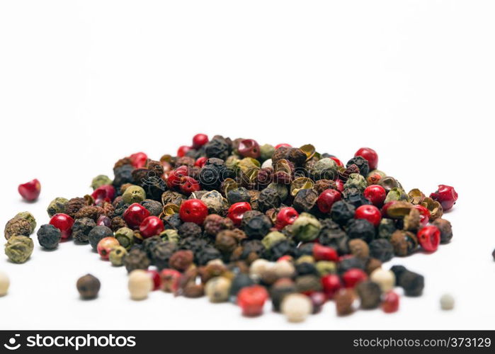 herbs and spices. heap fragrant peppers mix on a white background