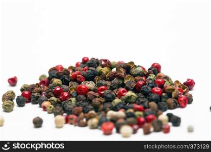 herbs and spices. heap fragrant peppers mix on a white background
