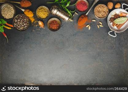 Herbs and spices on dark background - turkish, indian, asian cooking concept, flat lay, space for text. Herbs and spices on dark background, flat lay