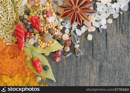 Herbs and spices on old table wood