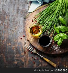 Herbs and spices on wooden board - cooking, healthy or vegetarian food concept