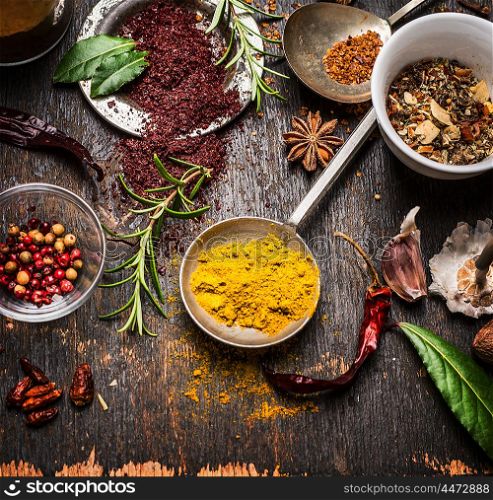 Herbs and spices selection with curry and staghorn sumac powder , close up