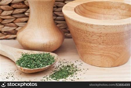 Herbs and wooden utensils in kitchen setting