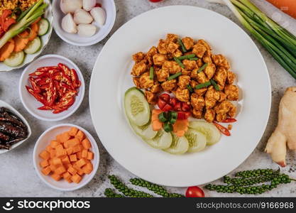 Herbs Fried chicken with Chili, Tomato, Cucumber, Carrot, and Fresh pepper.