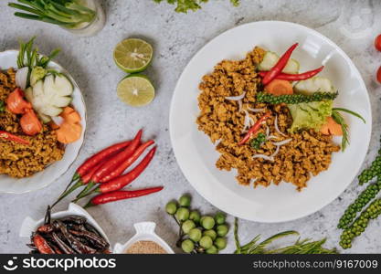 Herbs Fried chicken with Chili, Tomato, Cucumber, Carrot, and Fresh pepper.