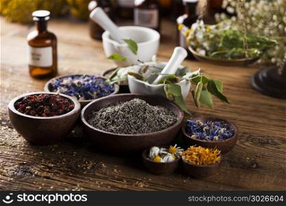 Herbs medicine,Natural remedy and mortar on vintage wooden desk . Herbal medicine on wooden desk background