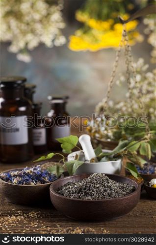 Herbs medicine,Natural remedy and mortar on vintage wooden desk . Herbal medicine on wooden desk background