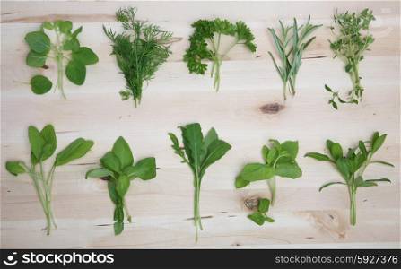 Herbs on wooden background - studio shot