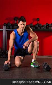 Hex dumbbells man workout in red gym floor