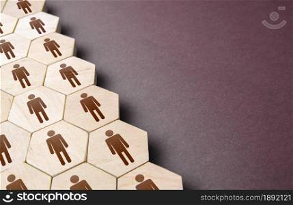 Hexagons with people in a structural order. Formation of company personnel, staffing. Hiring new employees and recruiting staff. Personnel management. Unity. Team discipline, teamwork cooperation.