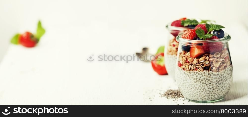 ?hia seeds vanilla pudding and berries on wooden rustic background - Healthy food, Diet, Detox, Clean Eating or Vegetarian concept. Background layout with free text space.