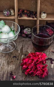 Hibiscus tea. Hibiscus tea rose and welding on the background of the tea shelves in vintage style.Photo tinted